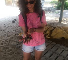 SEP student with baby crocodile on an Island at Ada
